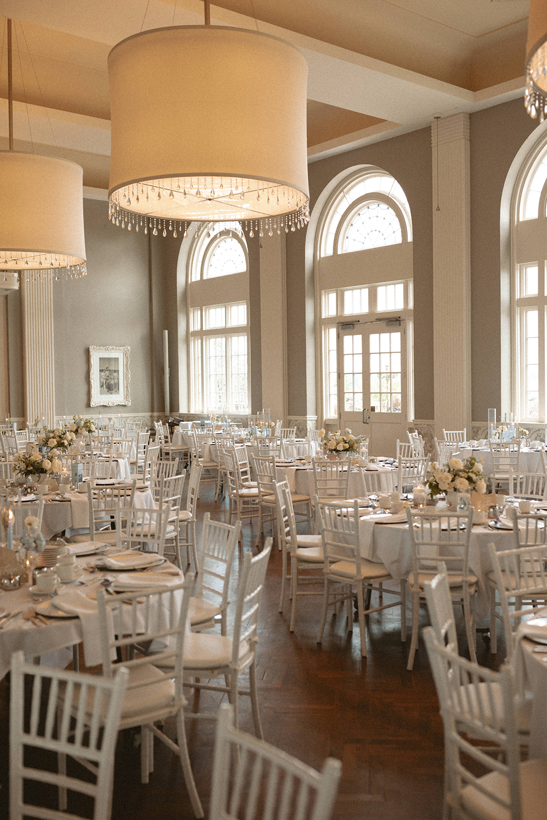 Bride and groom on the balcony and stairway at The Beach Club Minneapolis wedding venue